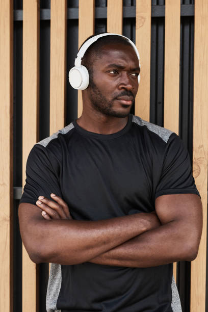 istock Muscular man standing outdoors 1342999135