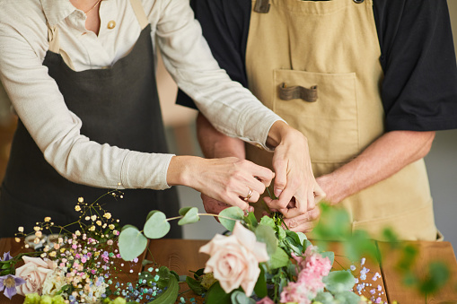 Two Florists Creating Bouquets