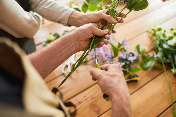 istock Florist Arranging Flowers Closeup 1342999305