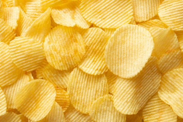 istock crispy golden potato chips snack texture background 1343023123