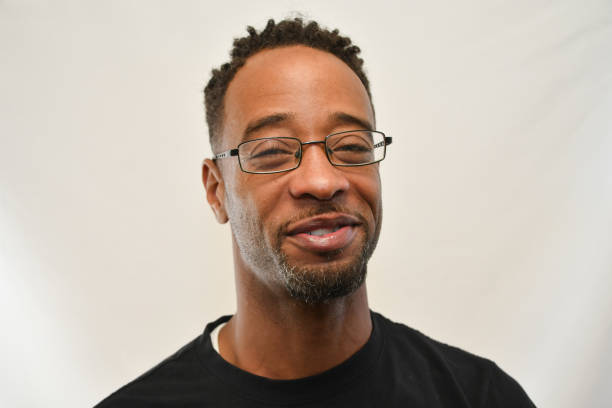 istock Black man in glasses smiles into the camera. 1343040067