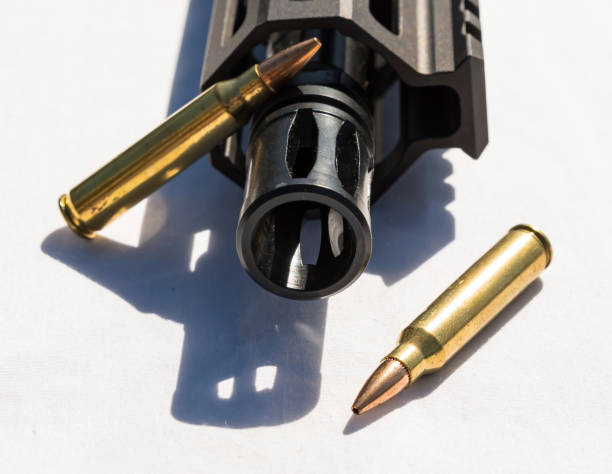 istock 223 caliber ammunition next to a AR15 barrel 1343062875