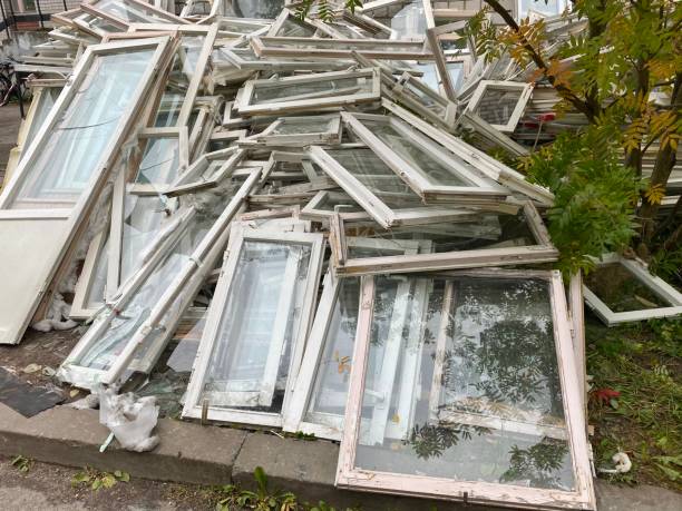 istock Dump of old windows and doors. Unnecessary windows and doors thrown in the street. 1343078710