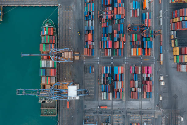 istock Aerial view container ship carrying container in import export business logistic and transportation of international by container ship in the open sea. 1343083953