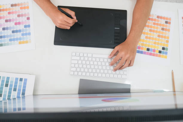 istock Young photographer and graphic designer at work in office. 1343084162