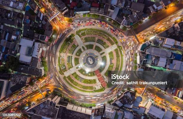 Road Roundabout With Car Lots Wongwian Yai In Bangkokthailand Street Large Beautiful Downtown At Night Light Aerial View Top View Cityscape Rush Hour Traffic Jam Stock Photo - Download Image Now