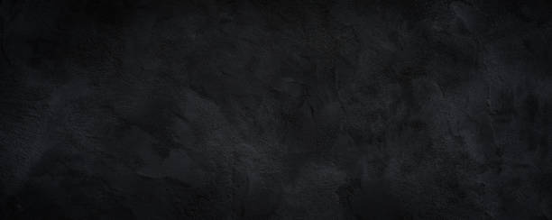 istock Black or dark gray rough grainy stone texture background 1343088814