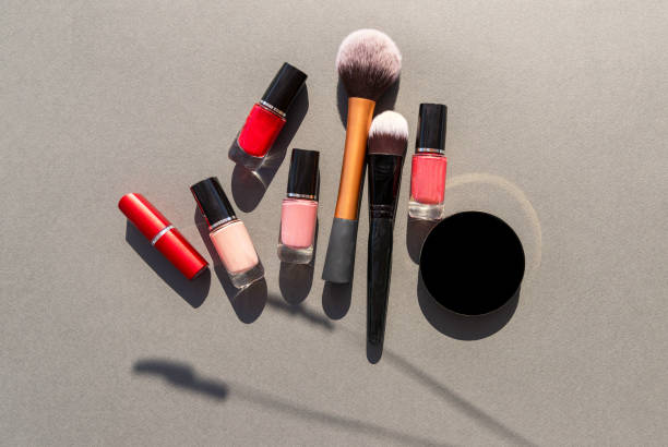 istock Make up the essentials. A set of professional makeup brushes and cosmetics on a gray, concrete background. 1343096274