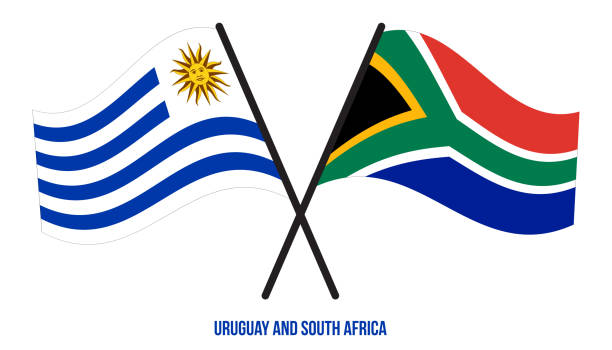 우루과이와 남아프리카 공화국 국기는 교차하고 플랫 스타일을 흔들. 공식 비율. 올바른 색상입니다. - uruguayan flag stock illustrations