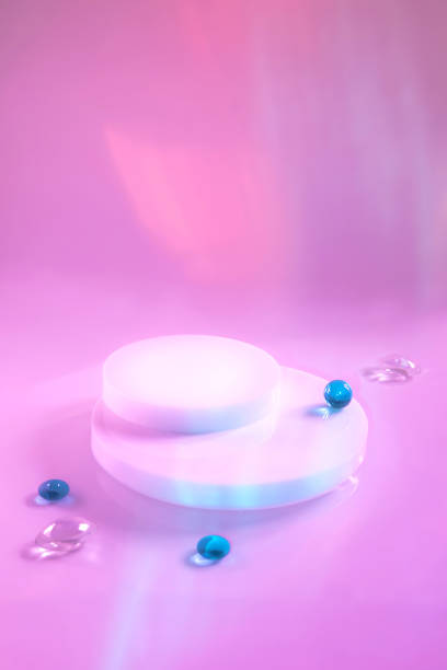 istock empty scene with cylinder podiums on holographic pink background 1343098377