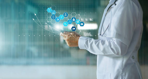 Medical examination and health insurance business via virtual interface technology.Doctor with stethoscope hold tablet analyse increased growth graph medical insurance and data network connection icon. stock photo