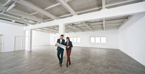 istock Business people discussing blueprint 1343100815