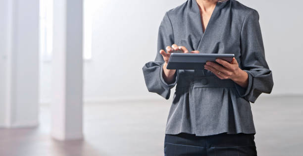 istock Close-up of businesswoman using digital tablet 1343100903