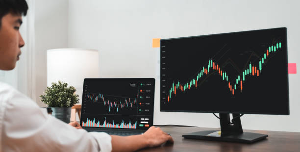 istock Stock exchange market concept, business people trader looking computer with graphs analysis candle line on table in office, diagrams on screen. 1343102323