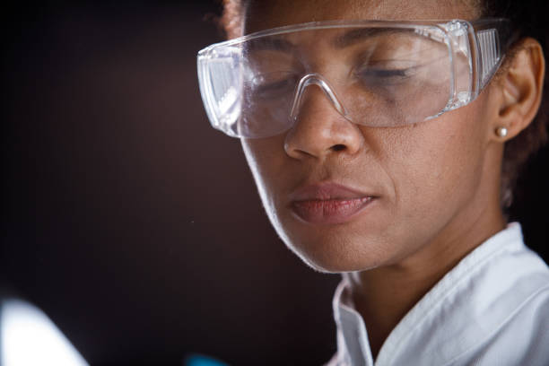 istock Copy space shot of female lab tech in protective eyewear looking donw 1343102581