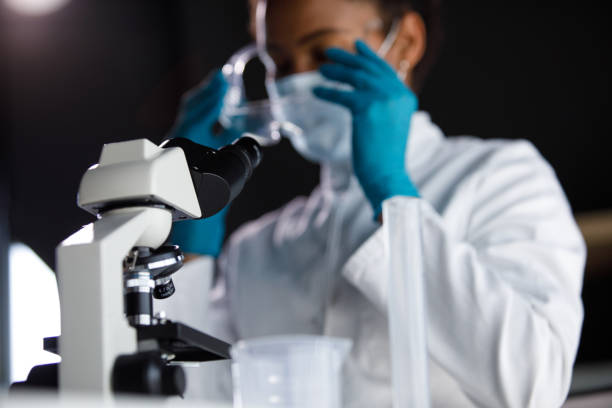 istock Selective focus shot of female scientist putting on protective eyewear 1343102589