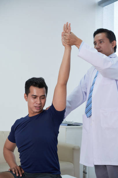 istock Asian Sportsman Getting Physiotherapy 1343114368