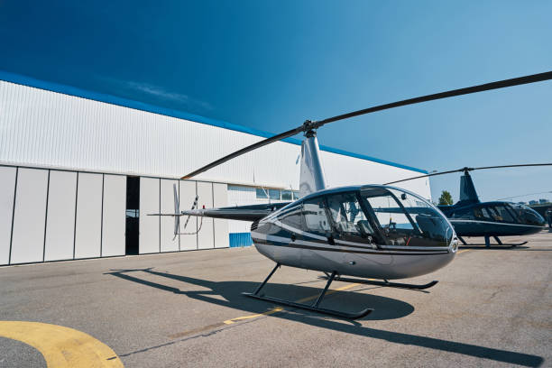 istock Two choppers on landing pad at vertiport 1343120690