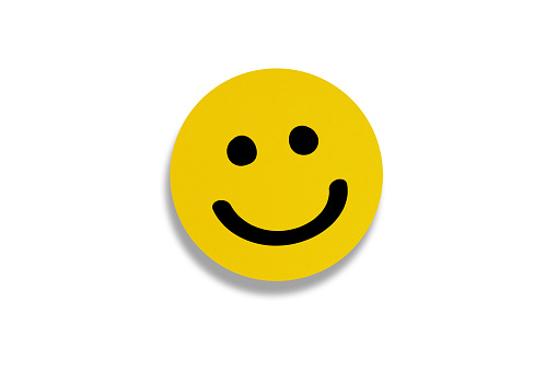 Happy smiley face emoticon on white background