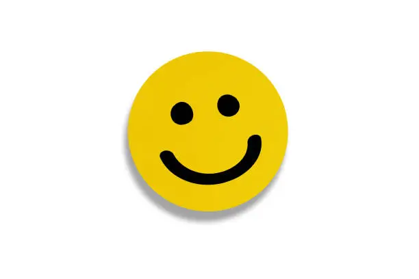 Photo of Happy smiley face emoticon on white background