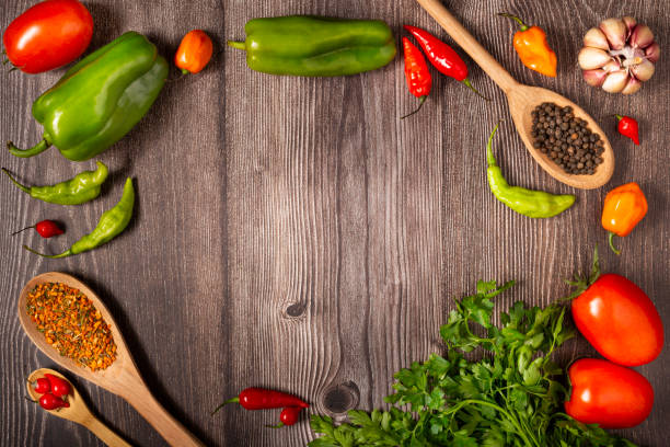 istock Ingredients for cooking with tomatoes, various peppers, garlic and green peppers. 1343136089