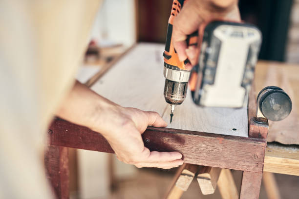 istock Man assembling furniture and fixing it - hobby concept. 1343136250