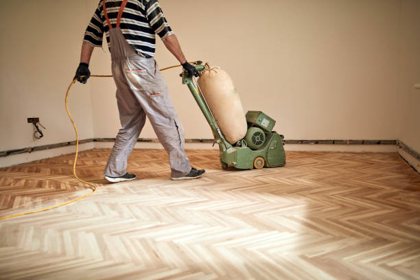istock Repairman restoring parquet with a sanding machine. 1343136492
