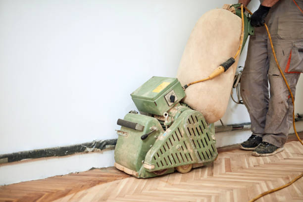 istock Repairman restoring parquet with a sanding machine. 1343136504