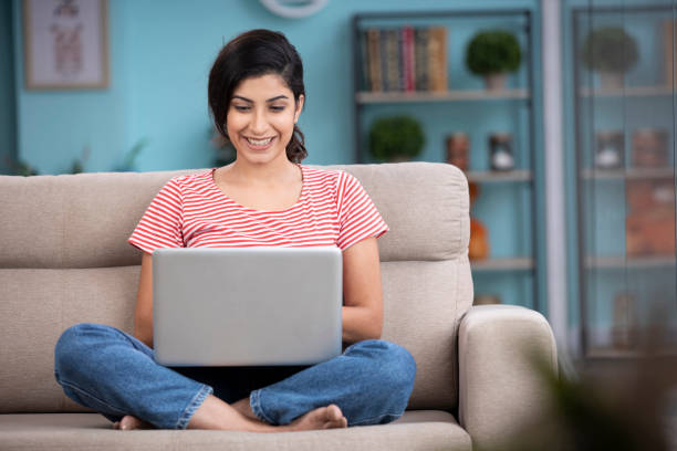 young woman using laptop, stock photos
