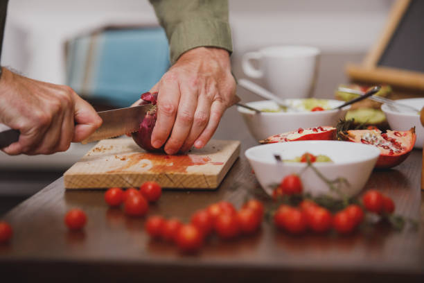 istock Copy space shot of man cutting up a Spanish onion 1343139361