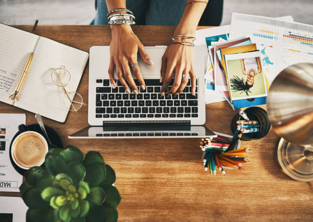 istock Shot of an unrecognisable businesswoman using a laptop while working remotely 1343152987