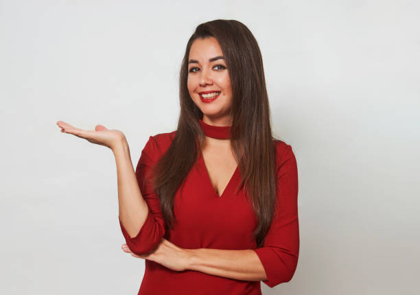 istock Young woman showing welcome gesture, close-up 1343153246