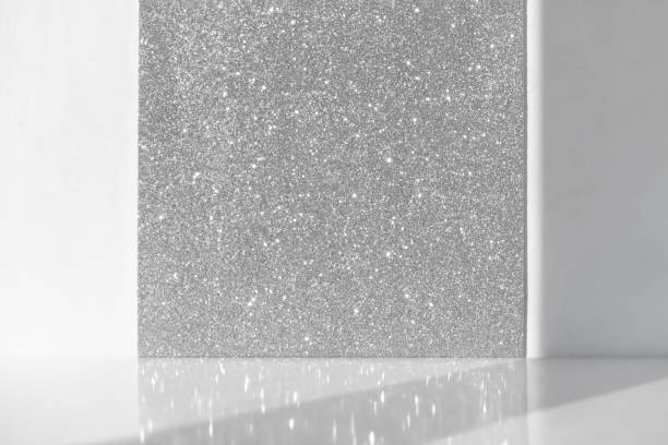 Minimal abstract white-silver shiny sparkling background for the presentation of a cosmetic product. Premium podium