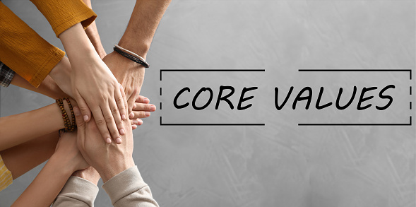 Core values concept. People holding hands together, top view