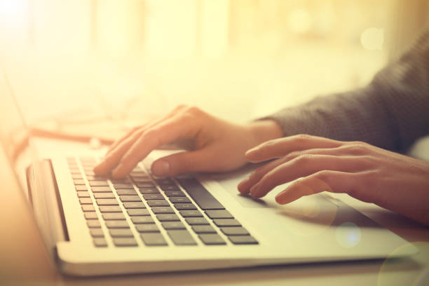 istock Woman working with laptop at table indoors, closeup 1343159513