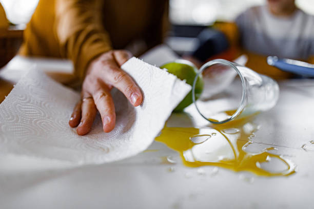 istock Cleaning spilled orange juice! 1343160727