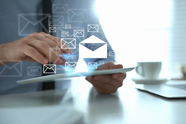 istock Businessman sending emails at table in office, closeup 1343164249