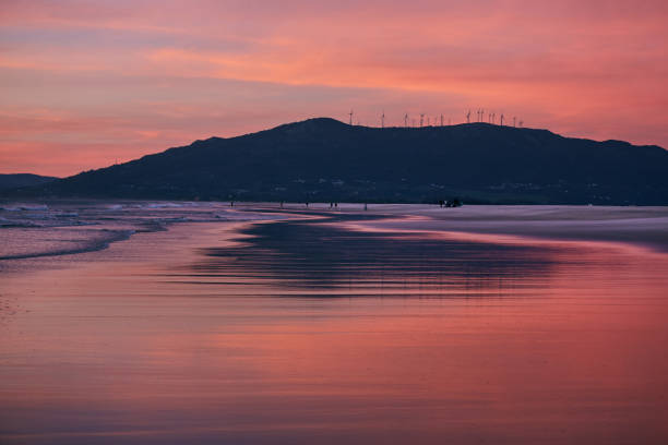 istock Sunset ocean beach of Spain Andalusia. Atlantic Ocean waves background bright magic summer sunset sky 1343178791