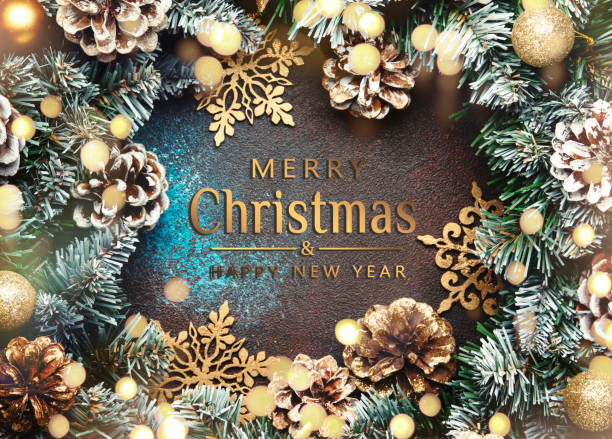 Merry Christmas and Happy New Year background with text. Green snow fir branches, pine cones, golden snowflakes, Christmas balls on brown background, top view Merry Christmas and Happy New Year background with text. Green snow fir branches, pine cones, golden snowflakes, Christmas balls on brown background, top view christmas pine cone frame branch stock pictures, royalty-free photos & images