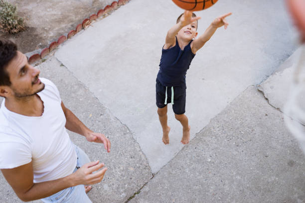 istock Father and son playing basketball 1343185729