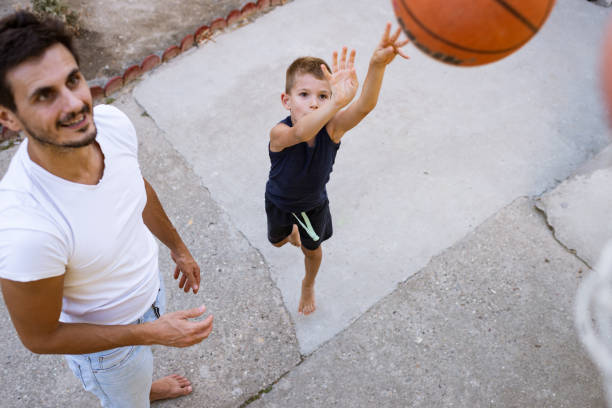 istock Father and son playing basketball 1343185845