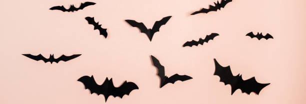istock Happy Halloween. Bats on pink pastel background. 1343185893