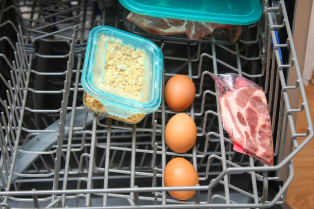 dishwasher cooking. cooking meat, eggs, fish, vegetables at low temperatures. - dishwasher cooking bildbanksfoton och bilder