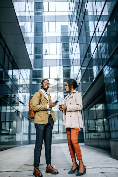 istock Two colleagues in front of company 1343189654
