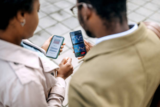 istock Young colleagues checking their crypto investment app 1343193247