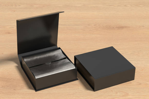 istock Black opened and closed square folding gift box mock up with silver wrapping paper on wooden background. Side view. 1343198588