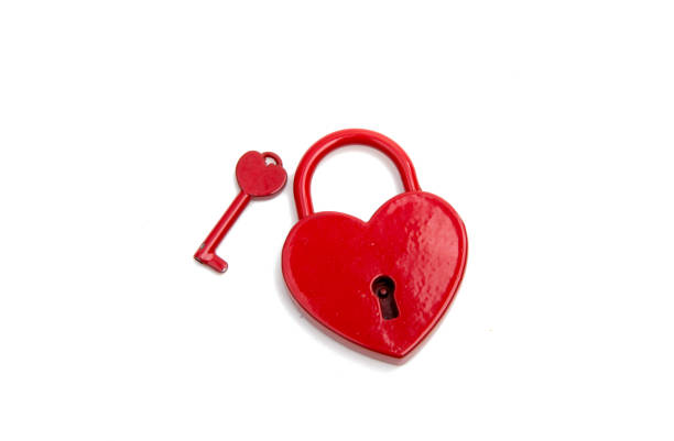 istock metalic red heart with a key on the white 1343199536