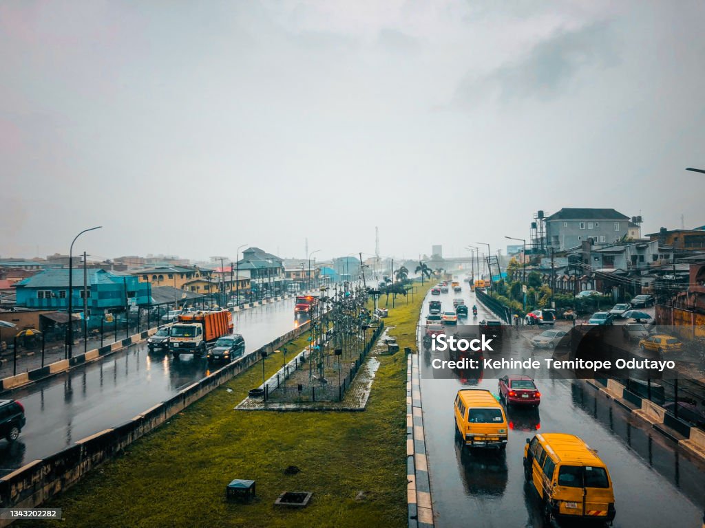 Traffic and cityscape of Lagos during the rain Ogudu, Lagos - Nigeria - September 25, 2021: Traffic and cityscape of Traffic and cityscape of Lagos during the rain Nigeria Stock Photo