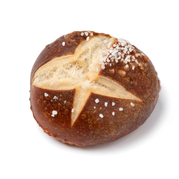 istock Fresh baked German pretzel bun close up on white background 1343202891