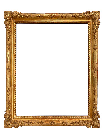 Vintage luxury golden frame with ornate baroque decoration on rustic textured wall background. Retro fancy picture frame for interior design.